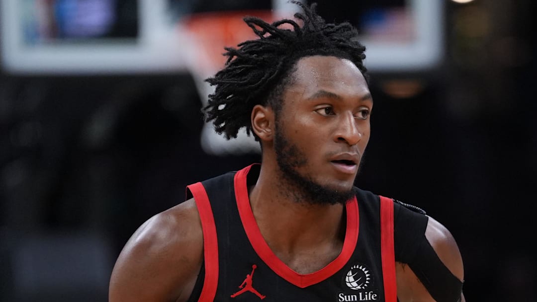 Jan 9, 2026; Boston, Massachusetts, USA; Toronto Raptors guard Immanuel Quickley (5) returns the ball against the Boston Celtics in the second half at TD Garden.