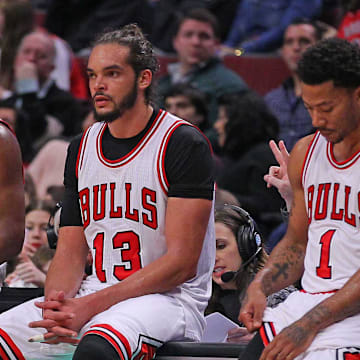 Feb 21, 2015; Chicago, IL, USA; Chicago Bulls guard Jimmy Butler (21), center Joakim Noah (13), and guard Derrick Rose (1) during the second half against the Phoenix Suns at the United Center. The Bulls won 112-107. 