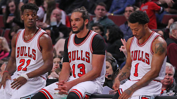 Feb 21, 2015; Chicago, IL, USA; Chicago Bulls guard Jimmy Butler (21), center Joakim Noah (13), and guard Derrick Rose (1) during the second half against the Phoenix Suns at the United Center. The Bulls won 112-107. 