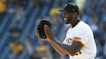 Sep 15, 2024; Pittsburgh, Pennsylvania, USA;  Pittsburgh Pirates relief pitcher Aroldis Chapman (45) reacts after the final out against the Kansas City Royals at PNC Park. Mandatory Credit: Charles LeClaire-Imagn Images