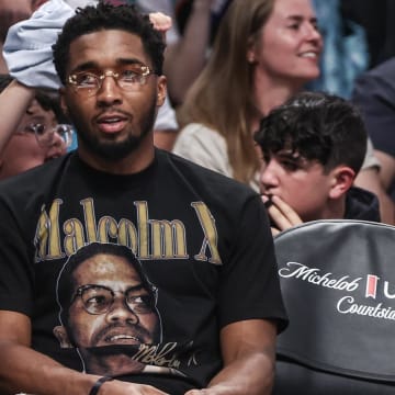 May 23, 2024; Brooklyn, New York, USA;  Cleveland Cavaliers guard Donovan Mitchell watches a game between the Chicago Sky and the New York Liberty in the second quarter at Barclays Center.