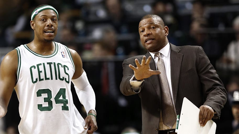Boston Celtics head coach Doc Rivers talks with small forward Paul Pierce.