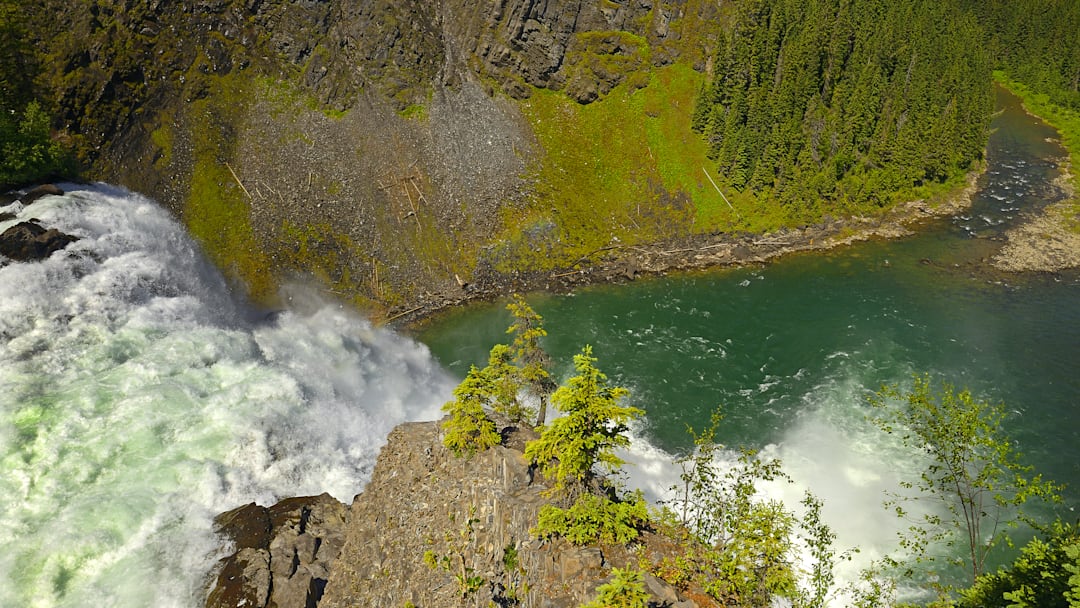 Kinuseo Falls, part of the Tumbler Ridge UNESCO Geopark, sits among trails that lead to dinosaur fossils and Late Cretaceous rock formations.