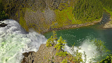Kinuseo Falls, part of the Tumbler Ridge UNESCO Geopark, sits among trails that lead to dinosaur fossils and Late Cretaceous rock formations.