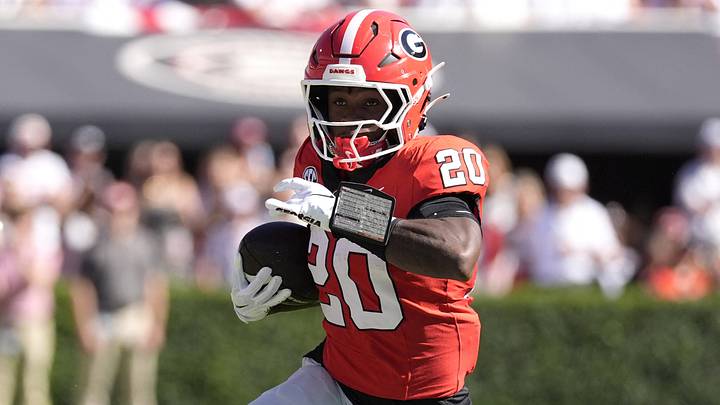 Sep 26, 2026; Athens, Georgia, USA;  Georgia Bulldogs running back Dwight Phillips Jr. (20) runs the ball against the Oklahoma Sooners defense during the first half at Sanford Stadium.  Mandatory Credit: Dale Zanine-Imagn Images