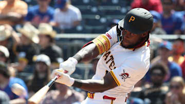 Jun 29, 2025; Pittsburgh, Pennsylvania, USA;  Pittsburgh Pirates center fielder Oneil Cruz (15) hits a two run home run for his second home run of he game against the New York Mets during the seventh inning at PNC Park. Mandatory Credit: Charles LeClaire-Imagn Images