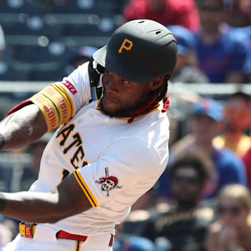 Jun 29, 2025; Pittsburgh, Pennsylvania, USA;  Pittsburgh Pirates center fielder Oneil Cruz (15) hits a two run home run for his second home run of he game against the New York Mets during the seventh inning at PNC Park. Mandatory Credit: Charles LeClaire-Imagn Images