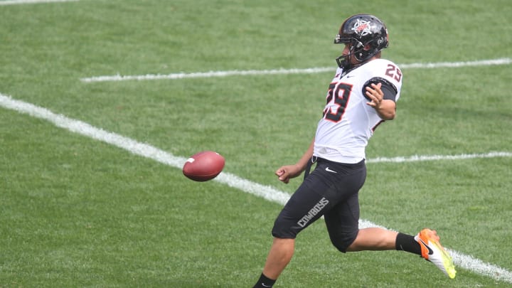 Sep 16, 2017; Pittsburgh, PA, USA;  Oklahoma State Cowboys punter Zach Sinor (29) punts to the Pittsburgh Panthers during the third quarter  at Heinz Field. The Cowboys won 59-21. Mandatory Credit: Charles LeClaire-USA TODAY Sports