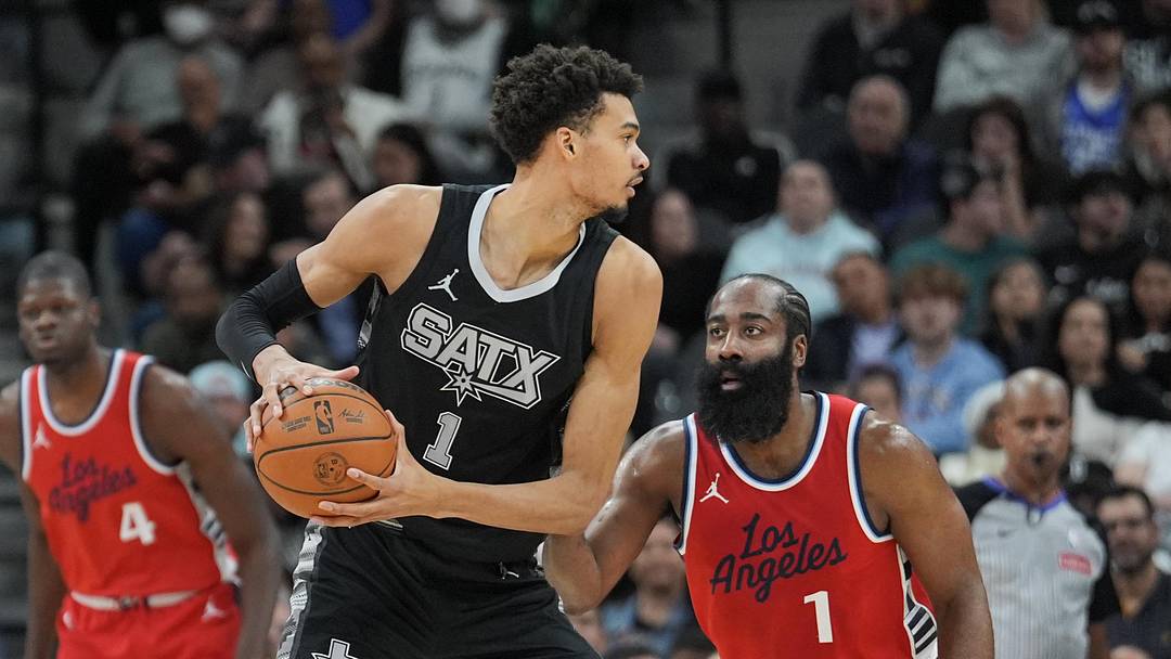 San Antonio Spurs center Victor Wembanyama (1) looks in against LA Clippers guard James Harden (1) in the first half at Frost Bank Center.