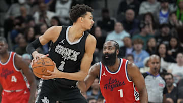San Antonio Spurs center Victor Wembanyama (1) looks in against LA Clippers guard James Harden (1) in the first half at Frost Bank Center.