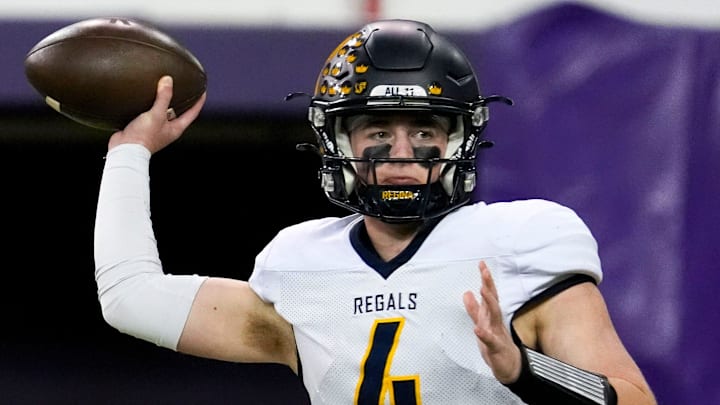 Iowa City Regina’s Kyle Tracy (4) passes the ball against the West Lyon Wildcats Nov. 20, 2025 during the Class 1A state football championship at the UNI-Dome in Cedar Falls, Iowa.