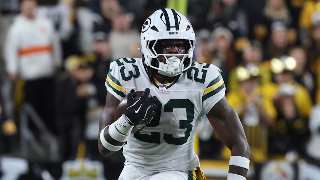 Oct 26, 2025; Pittsburgh, Pennsylvania, USA;  Green Bay Packers running back Emanuel Wilson (23) runs the ball against the Pittsburgh Steelers during the fourth quarter at Acrisure Stadium.