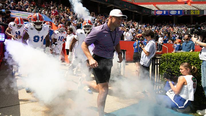 Florida head coach Jon Sumrall and the team blasts out onto the field before the Orange and Blue game at Steve Spurrier Field at Ben Hill Griffin Stadium in Gainesville, FL on Saturday, April 11, 2026. [Alan Youngblood/Gainesville Sun]