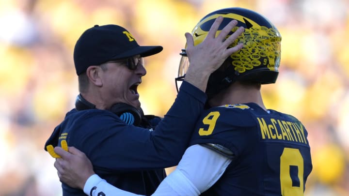 Jan 1, 2024; Pasadena, CA, USA; Michigan Wolverines head coach Jim Harbaugh (left) congratulates quarterback J.J. McCarthy (9) after a touchdown against the Alabama Crimson Tide during the first half in the 2024 Rose Bowl college football playoff semifinal game at Rose Bowl. Mandatory Credit: Jayne Kamin-Oncea-USA TODAY Sports