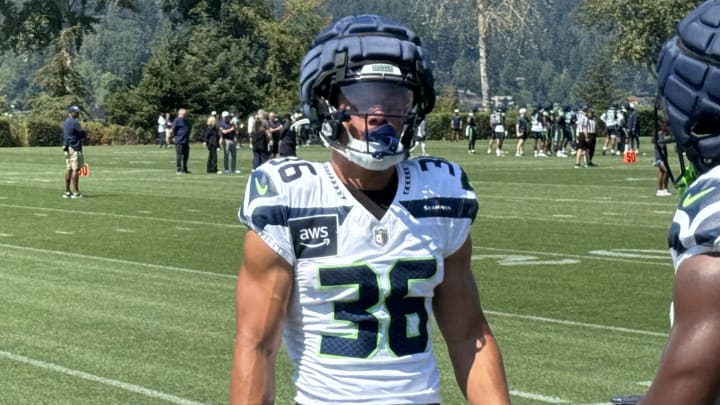 Seattle Seahawks running back George Holani participates in a blocking drill during training camp.