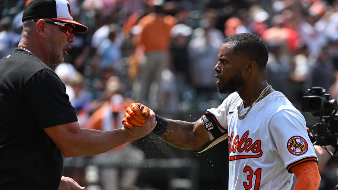 Jul 14, 2024; Baltimore, Maryland, USA;  Baltimore Orioles outfielder Cedric Mullins (31) celebrates with manager Brandon Hyde (18) after a win against the New York Yankees at Oriole Park at Camden Yards.