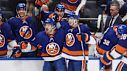 Apr 27, 2024; Elmont, New York, USA; New York Islanders center Mathew Barzal (13) celebrates with defenseman Noah Dobson (8) after scoring a goal in the second period against the Carolina Hurricanes in game four of the first round of the 2024 Stanley Cup Playoffs at UBS Arena. Mandatory Credit: Wendell Cruz-Imagn Images