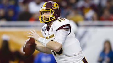 Dec 28, 2015; Detroit, MI, USA; Central Michigan Chippewas quarterback Cooper Rush (10) rushes the ball in the third quarter against the Minnesota Golden Gophers at Ford Field. Mandatory Credit: Rick Osentoski-Imagn Images