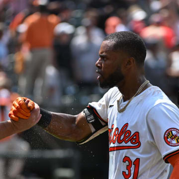 Jul 14, 2024; Baltimore, Maryland, USA;  Baltimore Orioles outfielder Cedric Mullins (31) celebrates with manager Brandon Hyde (18) after a win against the New York Yankees at Oriole Park at Camden Yards.