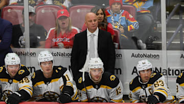 Oct 8, 2024; Sunrise, Florida, USA; Boston Bruins head coach Jim Montgomery looks on from the bench against the Florida Panthers during the third period at Amerant Bank Arena. Mandatory Credit: Sam Navarro-Imagn Images