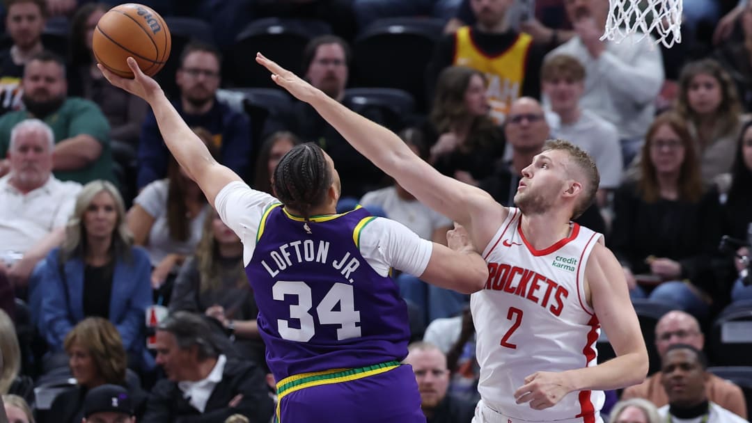 Apr 11, 2024; Salt Lake City, Utah, USA; Utah Jazz forward Kenneth Lofton Jr. (34) shoots against Houston Rockets center Jock Landale (2) during the third quarter at Delta Center. Mandatory Credit: Rob Gray-USA TODAY Sports