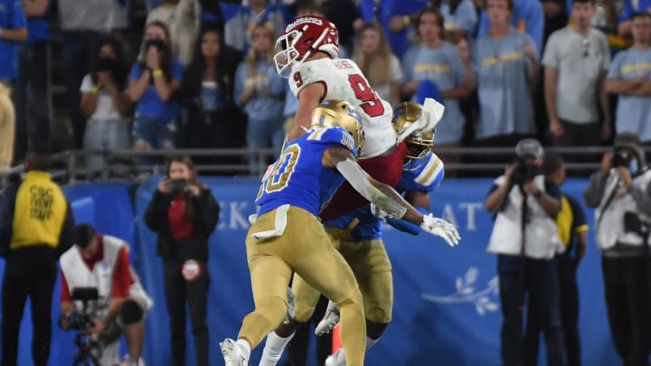 Sep 18, 2021; Pasadena, California, USA;  Fresno State Bulldogs quarterback Jake Haener (9) throws a pass as UCLA Bruins linebacker Ale Kaho (10) defends in the fourth quarter at Rose Bowl. Mandatory Credit: Richard Mackson-USA TODAY Sports