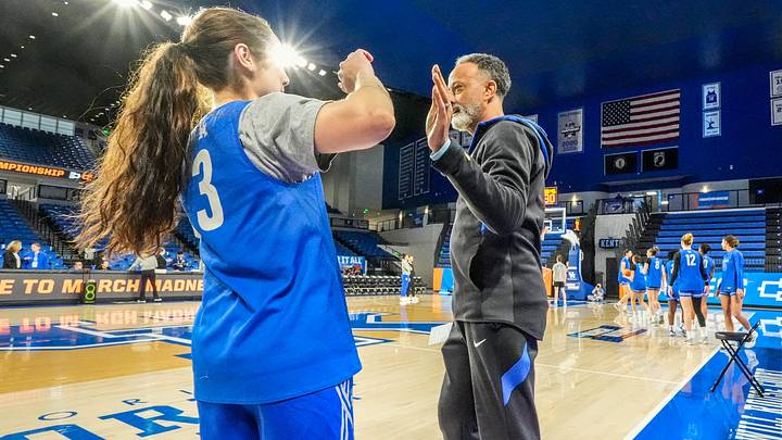 Kentucky coach Kenny Brooks high-fives players during shooting drills during practice ahead of the Wildcats’ NCAA first-round game against Liberty. Thursday, March 20, 2025