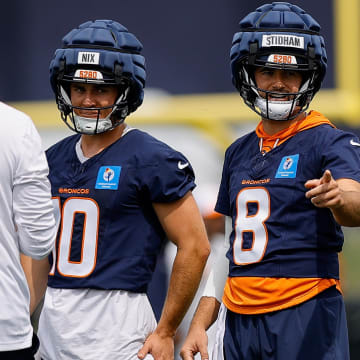 Jul 26, 2024; Englewood, CO, USA; Denver Broncos quarterback Jarrett Stidham (8) and quarterback Bo Nix (10) and quarterback Zach Wilson (4) during training camp at Broncos Park Powered by CommonSpirit. 