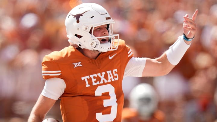 Texas Longhorns quarterback Quinn Ewers runs for a touchdown in the first quarter against the Kansas Jayhawks at Royal-Memorial Stadium on Saturday September 30, 2023.