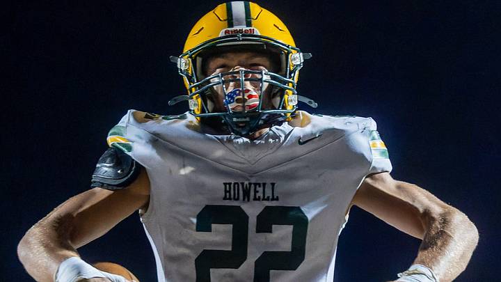 Howell's Bryce Kish flexes after his first touchdown of the evening during a victory over Brighton Friday, Oct. 17, 2025.