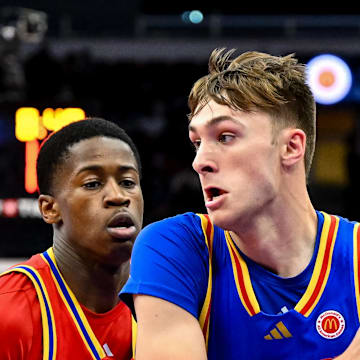 Apr 2, 2024; Houston, TX, USA; McDonald's All American East forward Cooper Flagg (32) controls the ball as McDonald's All American West guard Valdez Edgecombe Jr (7) defends during the first half at Toyota Center. Mandatory Credit: Maria Lysaker-Imagn Images