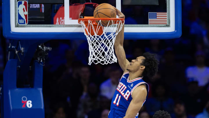 Mar 6, 2024; Philadelphia, Pennsylvania, USA; Philadelphia 76ers guard Jeff Dowtin Jr. (11) dunks the ball against the Memphis Grizzlies during the second quarter at Wells Fargo Center. Mandatory Credit: Bill Streicher-USA TODAY Sports