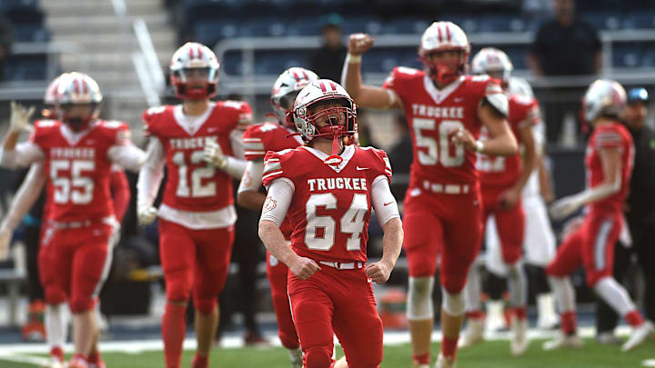 Truckee   s True Laboissonniere (64) celebrates after defeating SLAM 35-14 to win the 3A state championship at Mackay Stadium in Reno on Nov. 18, 2023.