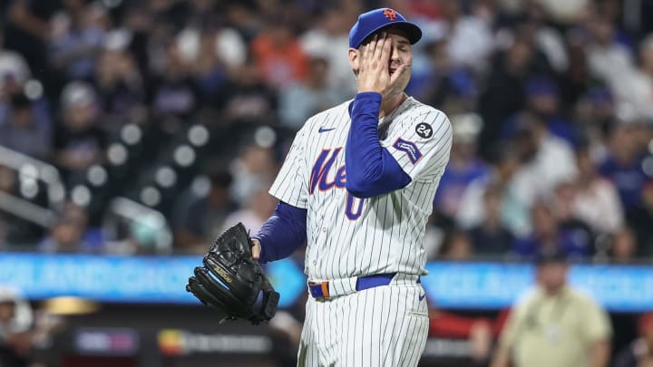 Jul 9, 2024; New York City, New York, USA;  New York Mets relief pitcher Adam Ottavino (0) walks off the field after getting taken out of the game in the eighth inning against the Washington Nationals at Citi Field. Mandatory Credit: Wendell Cruz-USA TODAY Sports