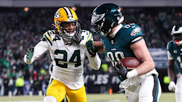 Jan 12, 2025; Philadelphia, Pennsylvania, USA; Philadelphia Eagles tight end Dallas Goedert (88) runs with the ball against Green Bay Packers cornerback Carrington Valentine (24) after a catch in an NFC wild card game at Lincoln Financial Field. Mandatory Credit: Bill Streicher-Imagn Images