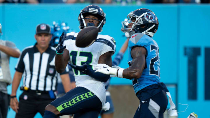 Seattle Seahawks wide receiver Easop Winston Jr. (13) hauls in a touchdown pass ahead of Tennessee Titans cornerback Tre Avery (23) during their game at Nissan Stadium in Nashvillet, Tenn., Saturday, Aug. 17, 2024.