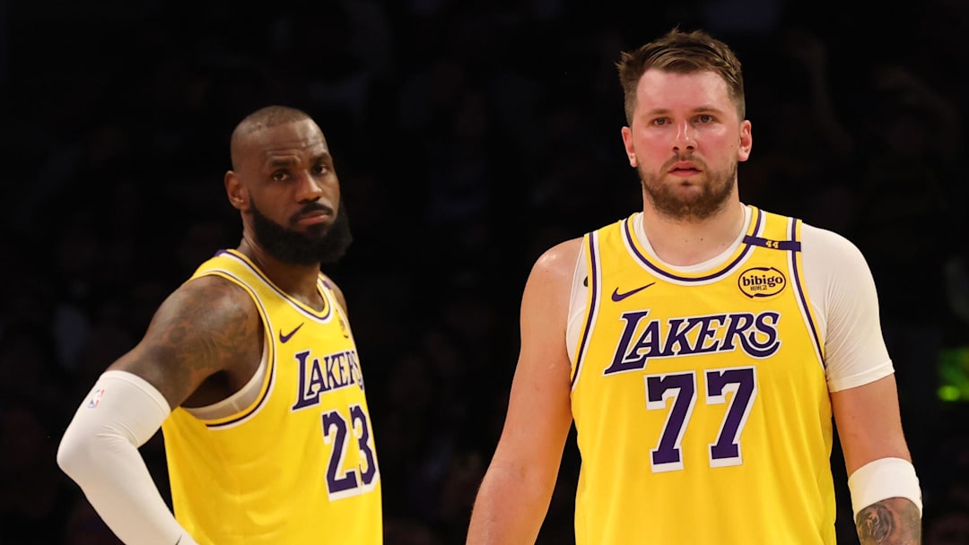 Feb 19, 2025; Los Angeles, California, USA; Los Angeles Lakers forward LeBron James (23) and guard Luka Doncic (77) during the second quarter against the Charlotte Hornets at Crypto.com Arena. Mandatory Credit: Jason Parkhurst-Imagn Images