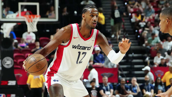 Jul 14, 2024; Las Vegas, NV, USA; Washington Wizards forward Alex Sarr (12) dribbles against the Houston Rockets during the first quarter at Thomas & Mack Center. Mandatory Credit: Stephen R. Sylvanie-USA TODAY Sports