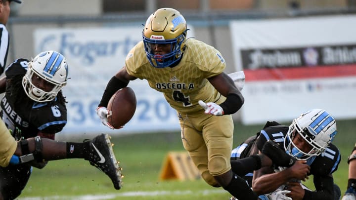 Taevion Swint of Osceola runs the ball against Rockledge in a 2022 contest. The UCF commit rushed for 2,880 yards and 38 touchdowns last fall, after gaining 1,666 yards and scoring 20 TDs in the Kowboys run to the 2022 state semifinals.