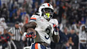 Nov 15, 2025; Durham, North Carolina, USA;  Virginia Cavaliers running back J'Mari Taylor (3) scores a touchdown against the Duke Blue Devils during the third quarter at Wallace Wade Stadium. Mandatory Credit: Zachary Taft-Imagn Images