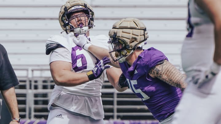 Zach Durfee delivers a blow to UW offensive guard Aidan Anderson.