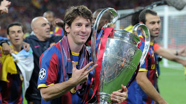 Lionel Messi with the Champions League trophy.