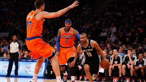 Nov 10, 2013; New York, NY, USA; San Antonio Spurs point guard Tony Parker (9) drives past New York Knicks small forward Carm