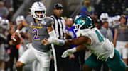 San Jose State Spartans quarterback Chevan Cordeiro (2) scrambles away from Coastal Carolina Chanticleers defensive lineman Will Whitson (44) during the third quarter of the Easypost Hawaii Bowl at Clarence T.C. Ching Athletics Complex.