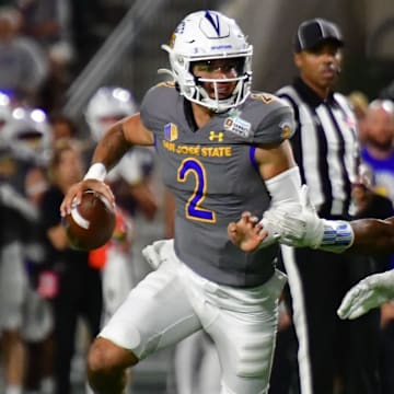 San Jose State Spartans quarterback Chevan Cordeiro (2) scrambles away from Coastal Carolina Chanticleers defensive lineman Will Whitson (44) during the third quarter of the Easypost Hawaii Bowl at Clarence T.C. Ching Athletics Complex.