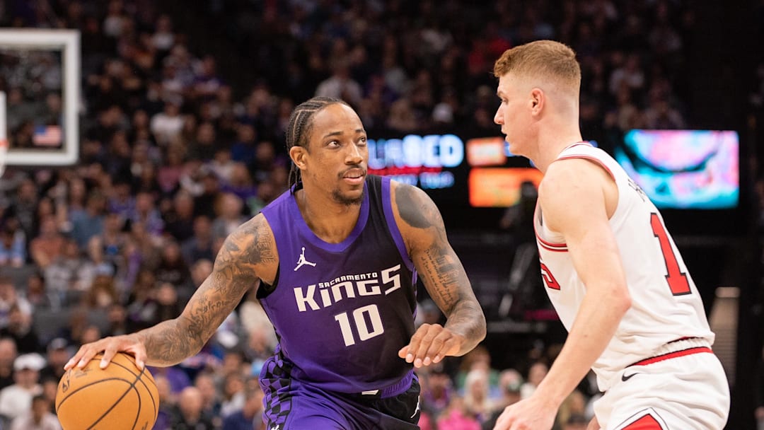 Mar 20, 2025; Sacramento, California, USA; Sacramento Kings forward DeMar DeRozan (10) controls the ball against Chicago Bulls guard Kevin Huerter (13) during the second quarter at Golden 1 Center. Mandatory Credit: Ed Szczepanski-Imagn Images