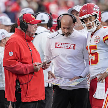 Nov 24, 2024; Charlotte, North Carolina, USA;  Kansas City Chiefs head coach Andy Reid talks with quarterback Patrick Mahomes (15) during a time out during the second half against the Carolina Panthers at Bank of America Stadium. Mandatory Credit: Jim Dedmon-Imagn Images