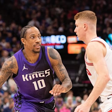 Mar 20, 2025; Sacramento, California, USA; Sacramento Kings forward DeMar DeRozan (10) controls the ball against Chicago Bulls guard Kevin Huerter (13) during the second quarter at Golden 1 Center. Mandatory Credit: Ed Szczepanski-Imagn Images