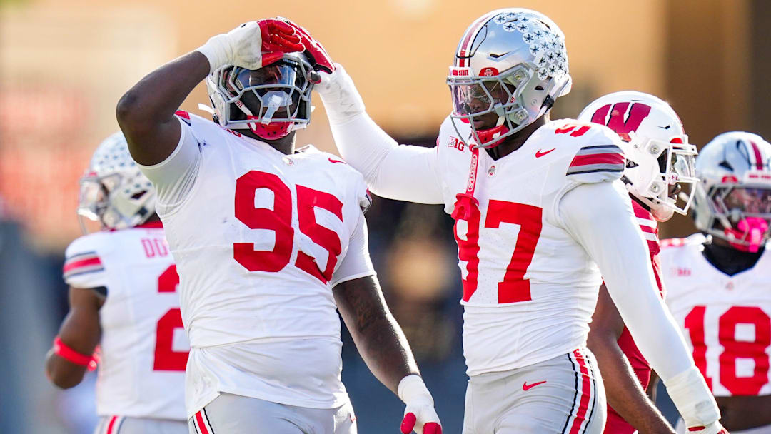 Ohio State Buckeyes defensive tackle Tywone Malone (95) and defensive end Kenyatta Jackson Jr. (97) celebrate in the first half at Camp Randall Stadium on Saturday, Oct. 18, 2025 in Madison, Wisconsin.