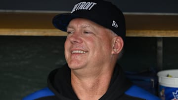Detroit Tigers manager A.J. Hinch (14) jokes around with his players in the dugout before their game against the Seattle Mariners at Comerica Park.